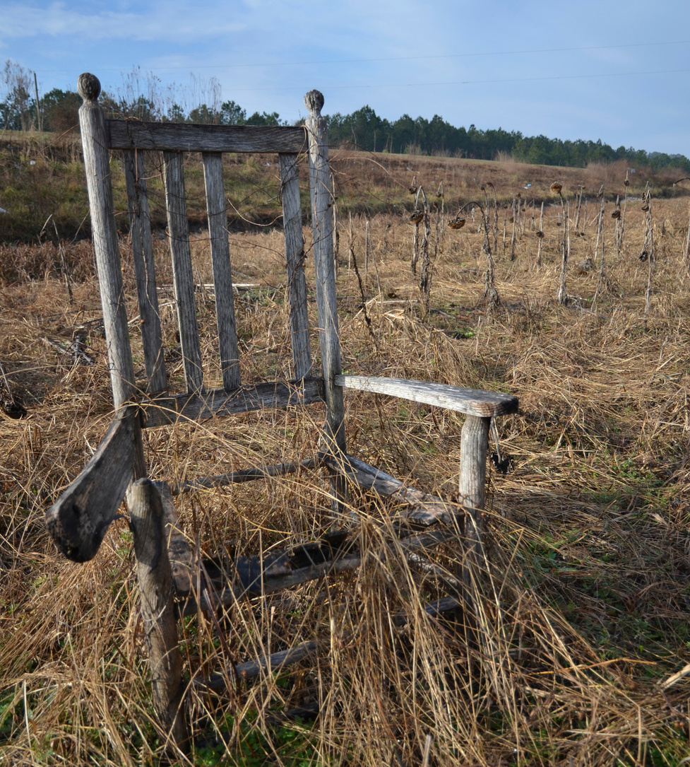 Abandoned Chair in Field